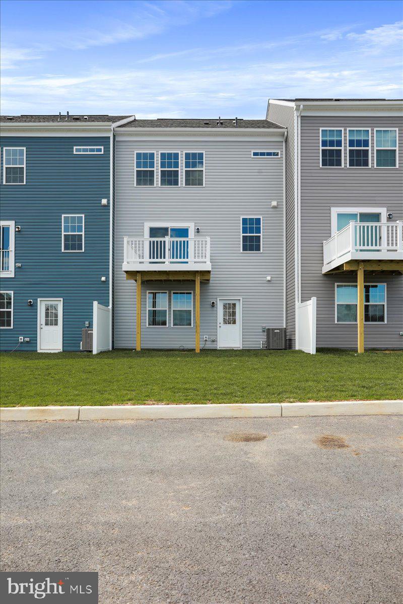 71 Stafford Place Falling Waters, WV 25419 - Photo 44 of 48 a view of a house with a yard and a garage