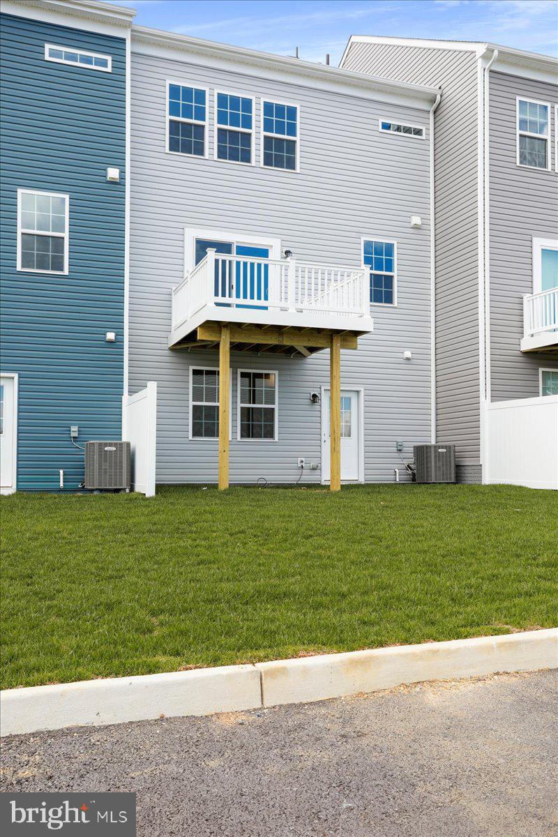 71 Stafford Place Falling Waters, WV 25419 - Photo 45 of 48 a front view of a house with a garden