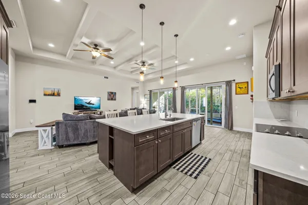 a large kitchen with stainless steel appliances kitchen island granite countertop a large counter top and stove