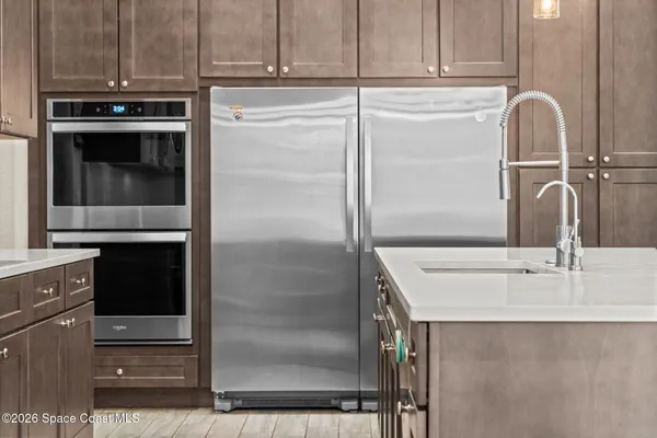 a kitchen with appliances and cabinets