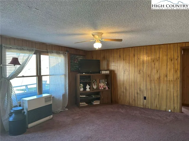 a view of room with furniture and a window