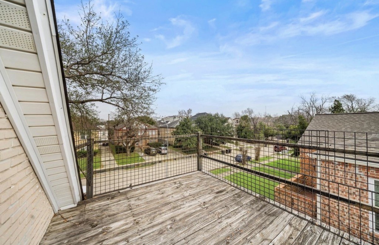 1633 Castle Court Houston, TX 77006 - Photo 20 of 38 Spacious upper deck offering a peaceful outdoor retreat with views of the surrounding neighborhood—perfect for morning coffee, evening relaxation, or enjoying fresh air right at home.