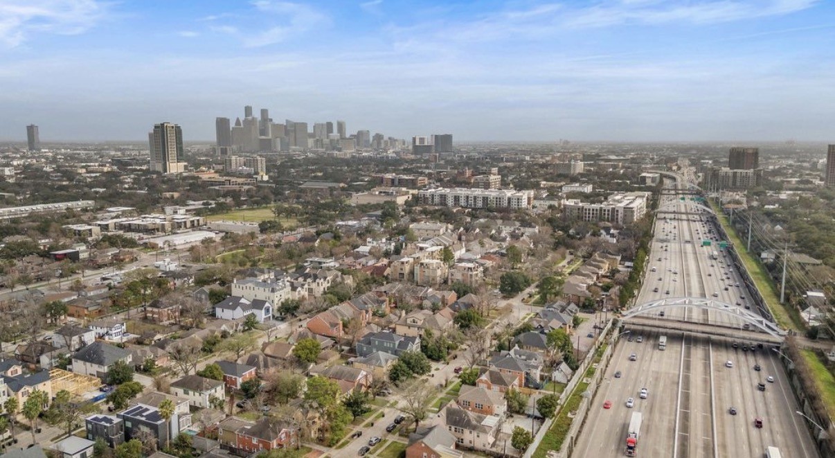 1633 Castle Court Houston, TX 77006 - Photo 22 of 38 Expansive aerial view showcasing the property’s prime central location with quick access to major freeways and a clear sightline to Downtown Houston. Perfectly positioned for convenience, commuting, and enjoying everything the city has to offer.