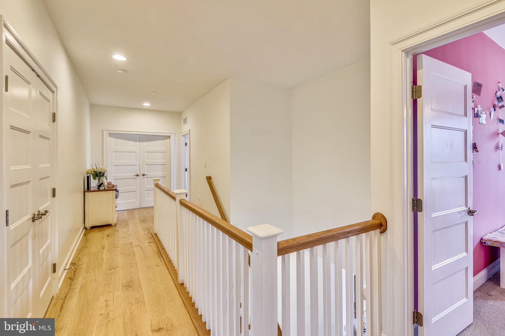 1013 Shore Acres Road Arnold, MD 21012 - Photo 23 of 67 Second-floor catwalk with hardwood flooring