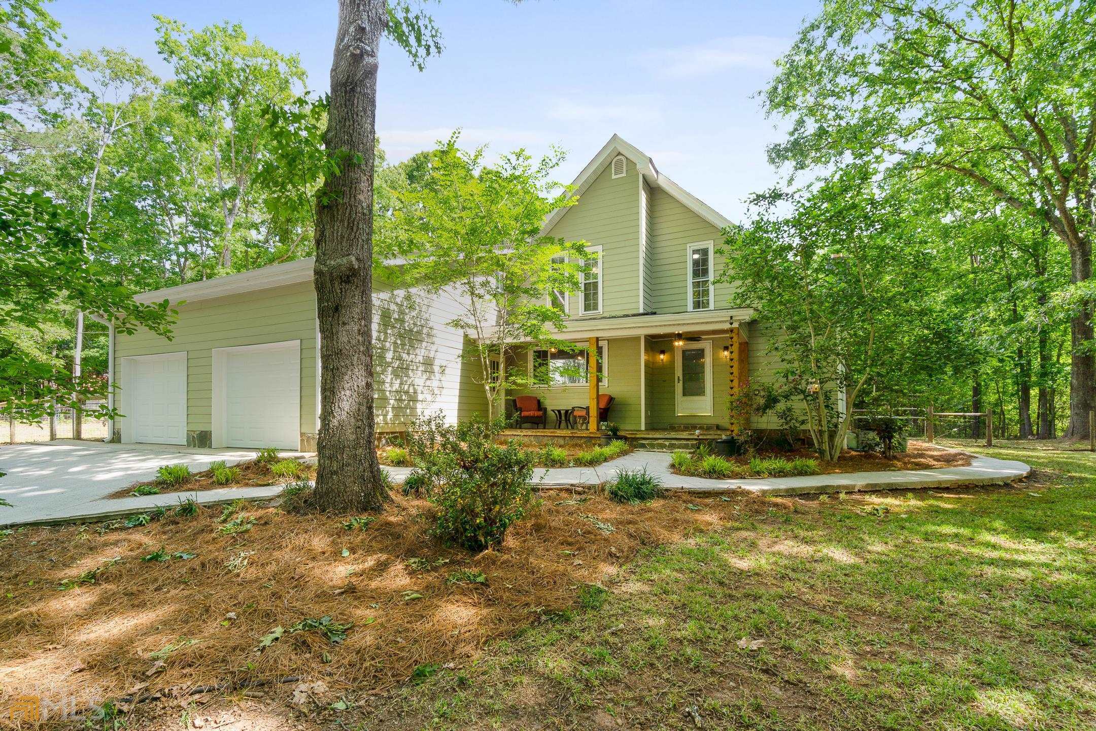 1280 Moreland Road Williamson, GA 30292 - Photo 1 of 1 a view of a house with a yard and plants