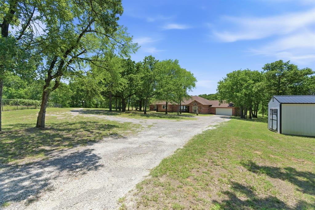 321 Cr 211 Road Gainesville, TX 76240 - Photo 2 of 40 Plenty of space for vehicles, trailers at the entry.