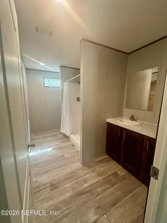 a bathroom with a sink and a mirror