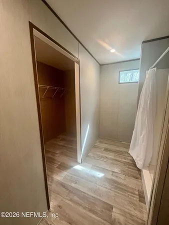 a view of entryway with wooden floor