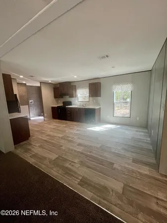 a view of livingroom with furniture and window
