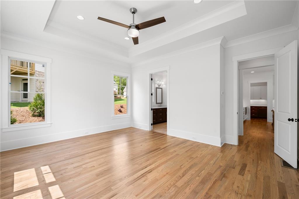 326 Reese Way Ball Ground, GA 30107 - Photo 13 of 37 wooden floor in an empty room with a window