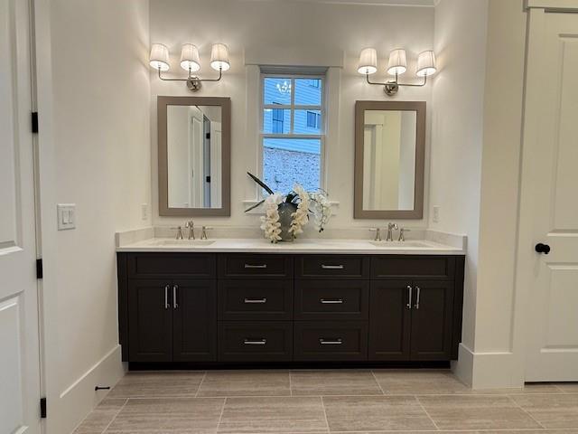 326 Reese Way Ball Ground, GA 30107 - Photo 17 of 37 a bathroom with a sink double vanity and a mirror