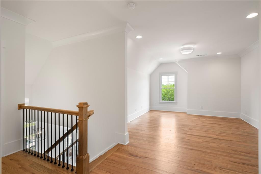 326 Reese Way Ball Ground, GA 30107 - Photo 20 of 37 a view of empty room with wooden floor and fan