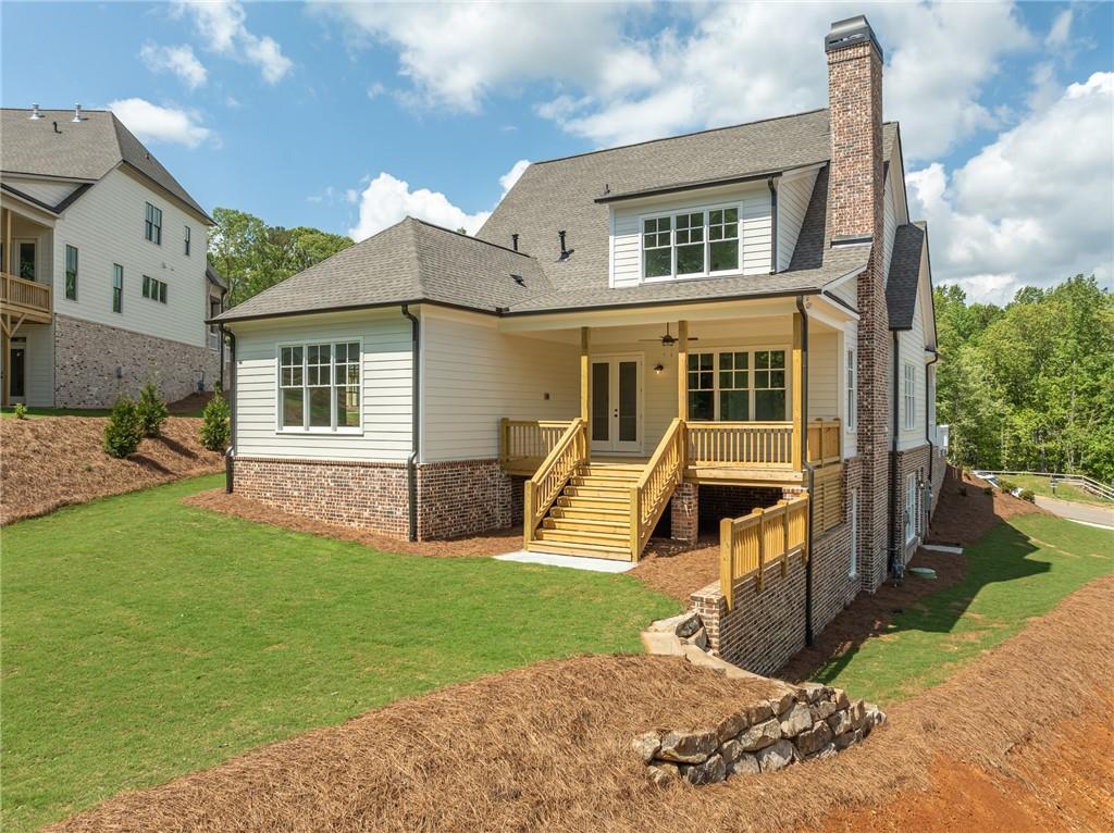 326 Reese Way Ball Ground, GA 30107 - Photo 35 of 37 front view of a house with a yard