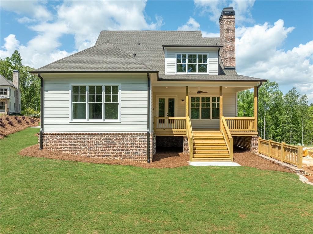 326 Reese Way Ball Ground, GA 30107 - Photo 36 of 37 a front view of a house with garden