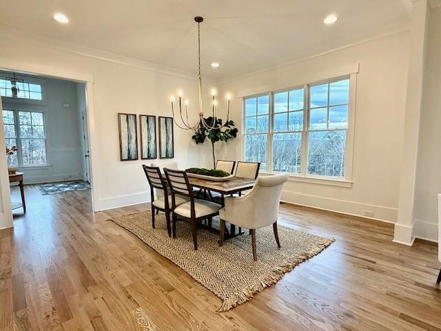 326 Reese Way Ball Ground, GA 30107 - Photo 6 of 37 a view of a dining room with furniture window and wooden floor