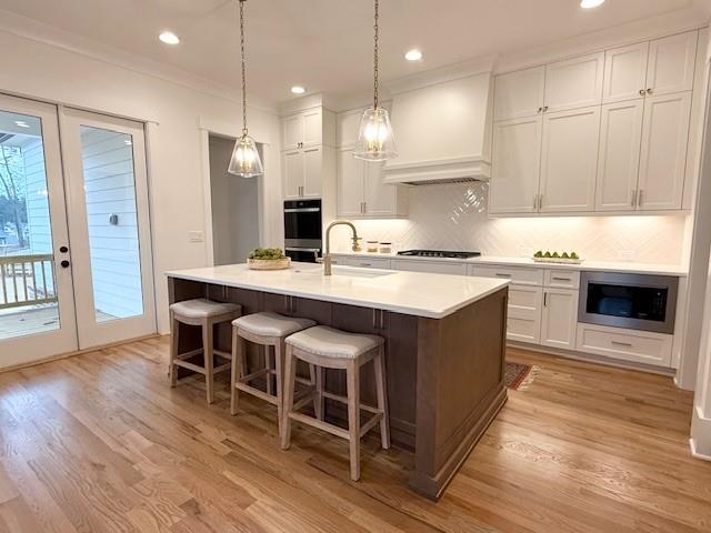 326 Reese Way Ball Ground, GA 30107 - Photo 8 of 37 a kitchen with a stove a refrigerator and a sink