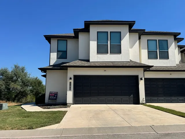 a front view of a house with yard