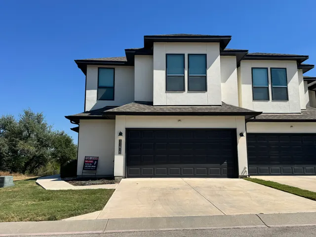 a front view of a house with yard