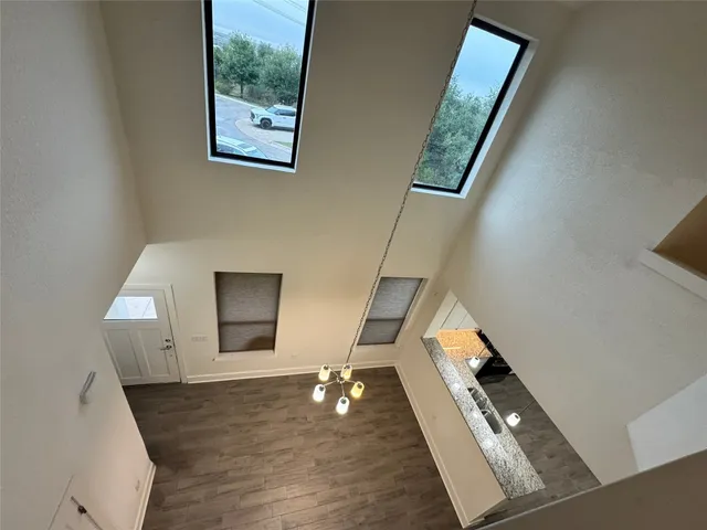 a view of a hallway with a dining room