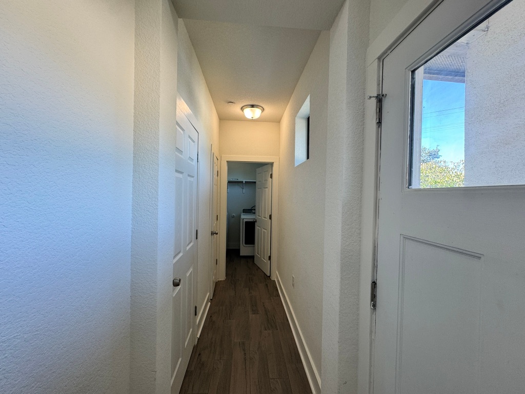 11415 Culzean Castle Drive Austin, TX 78717 - Photo 6 of 21 a view of a hallway with a dining room