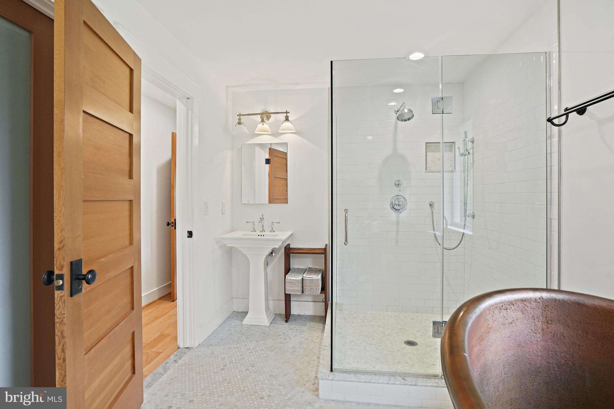 4621 Drummond Avenue Chevy Chase, MD 20815 - Photo 18 of 33 a bathroom with a tub and shower