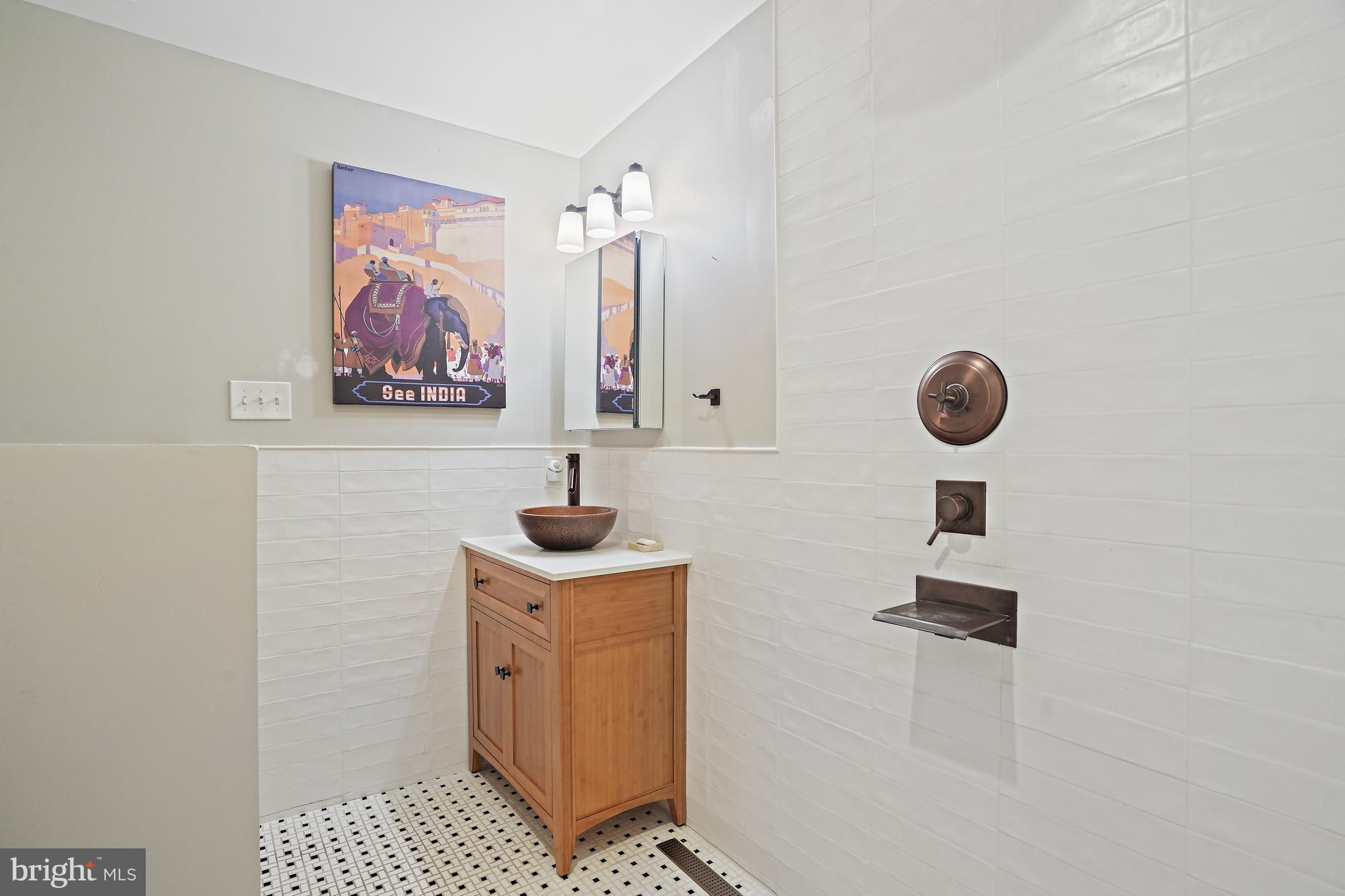 4621 Drummond Avenue Chevy Chase, MD 20815 - Photo 20 of 33 a bathroom with a shower