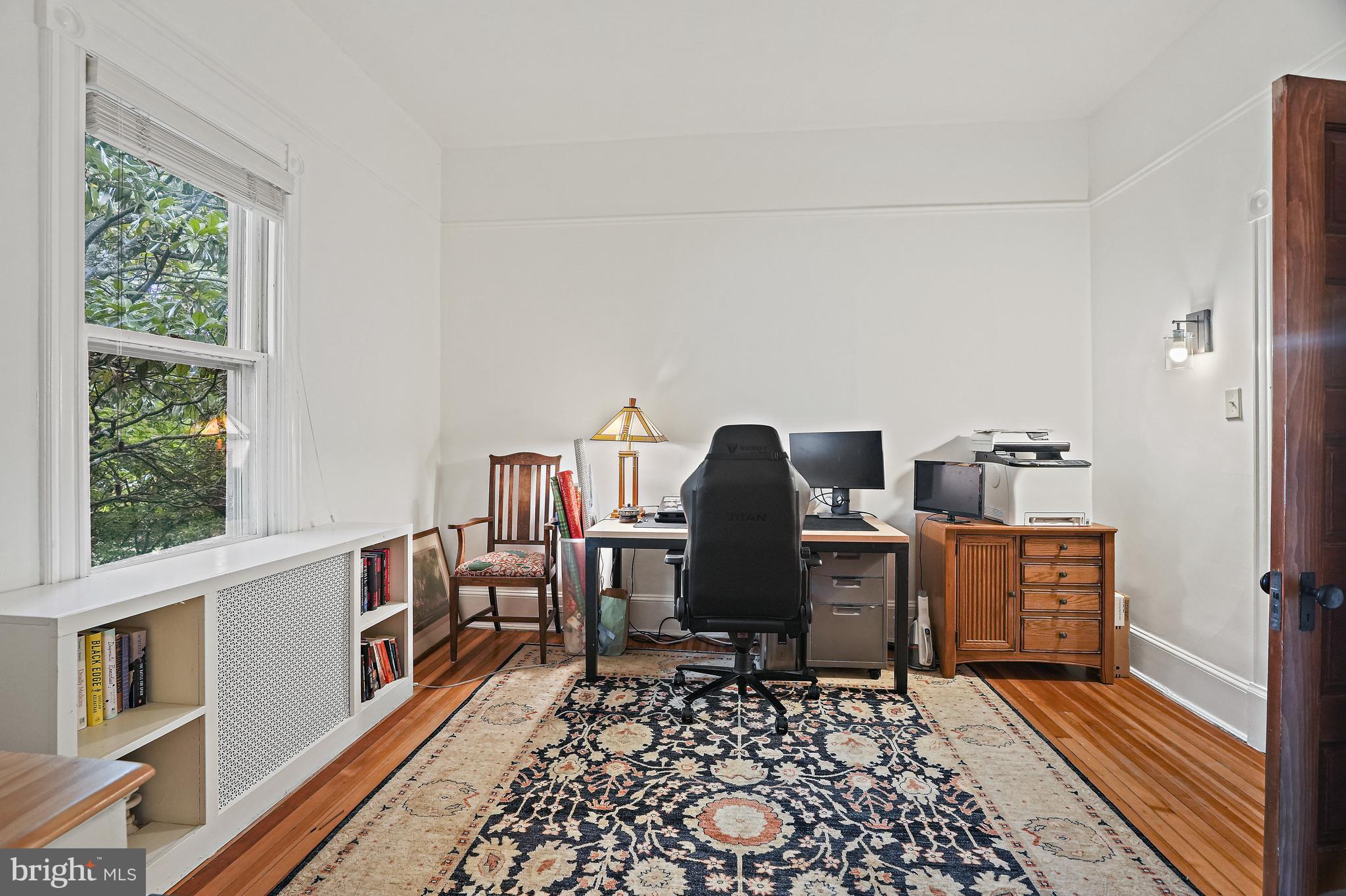 4621 Drummond Avenue Chevy Chase, MD 20815 - Photo 21 of 33 a view of a workspace with furniture and a window