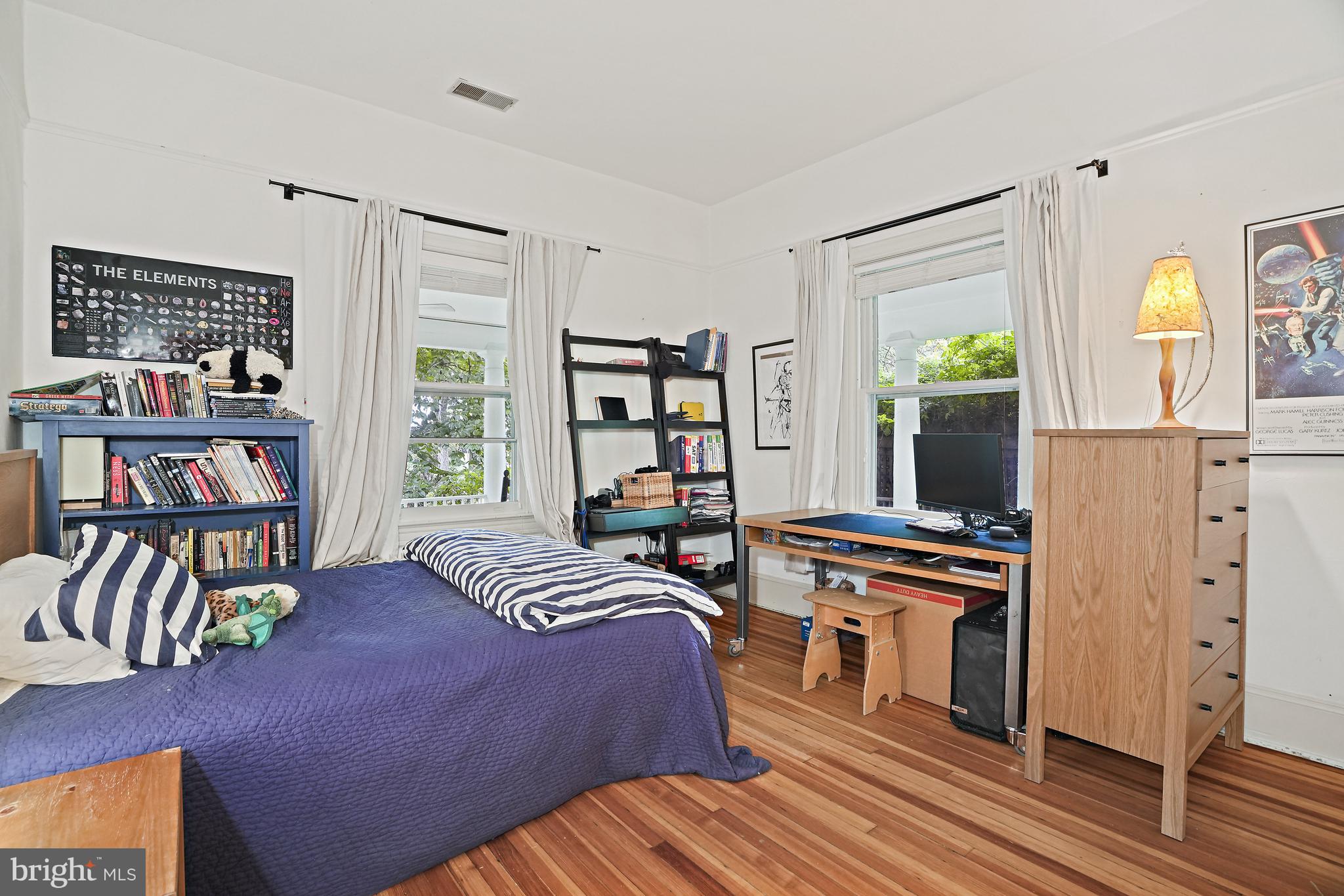 4621 Drummond Avenue Chevy Chase, MD 20815 - Photo 24 of 33 a bedroom with a bed and a flat screen tv