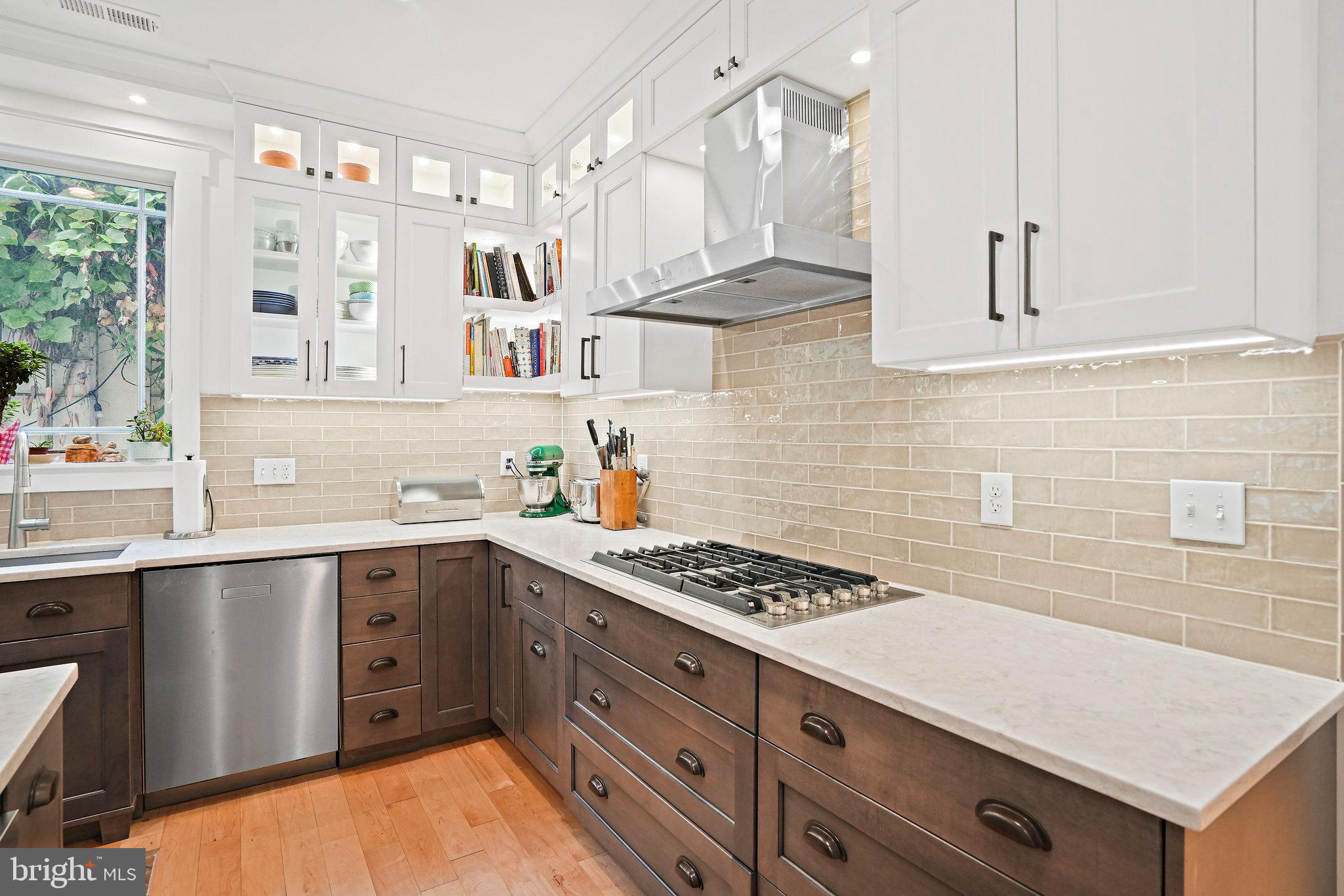 4621 Drummond Avenue Chevy Chase, MD 20815 - Photo 8 of 33 a kitchen with stainless steel appliances granite countertop a stove and a sink