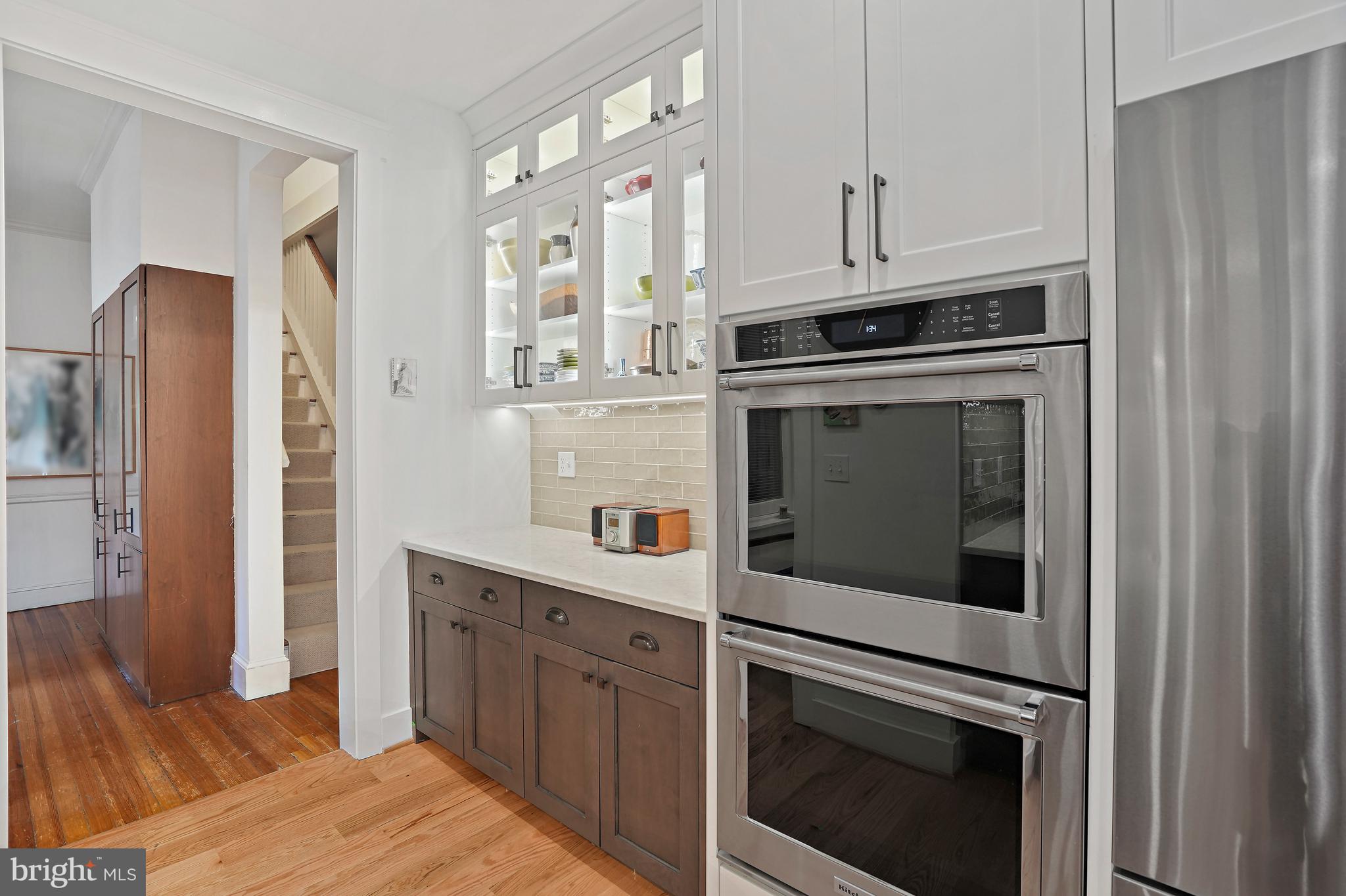 4621 Drummond Avenue Chevy Chase, MD 20815 - Photo 9 of 33 a kitchen with cabinets stainless steel appliances and counter space