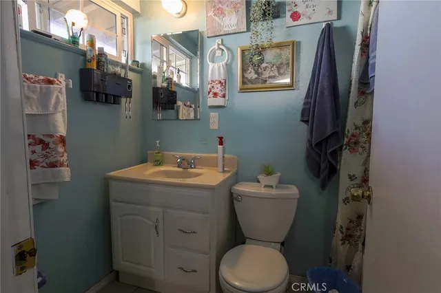 a bathroom with a toilet and a sink