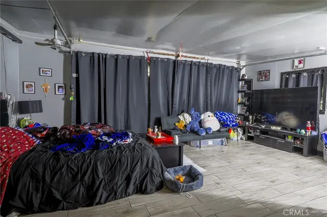 a bed room with a bed and a chair