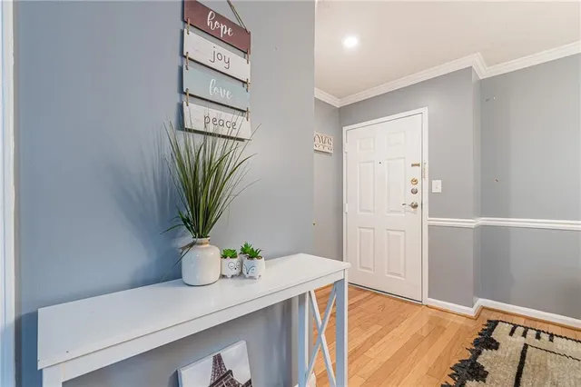 a view of a bedroom with wooden floor