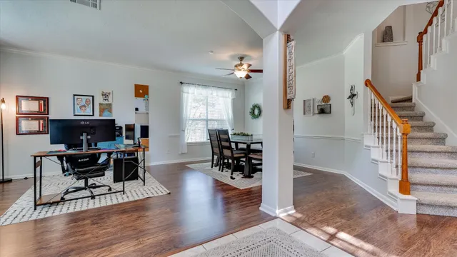 a view of a dining room with furniture and wooden floor