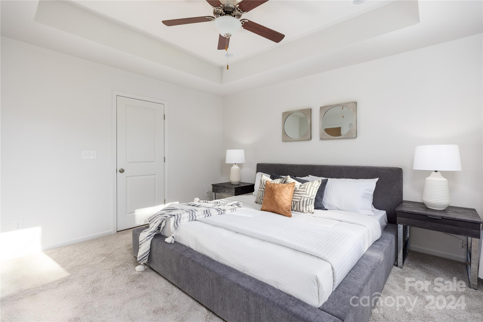 3712 Piney Grove Road Charlotte, NC 28212 - Photo 15 of 23 a bedroom with a bed and a ceiling fan