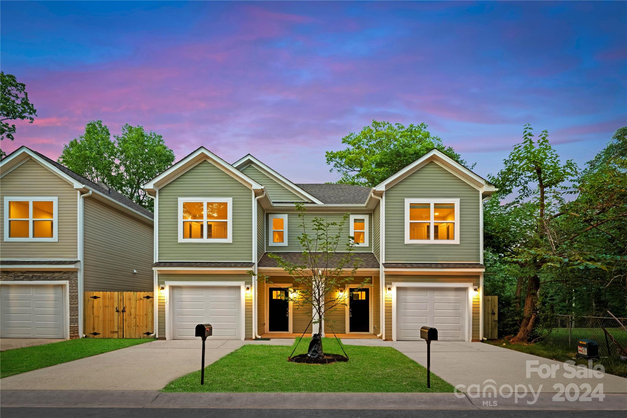 3712 Piney Grove Road Charlotte, NC 28212 - Photo 2 of 23 a front view of a house with a yard and garage