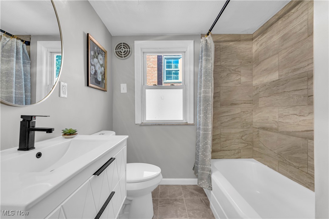 2425 Canterbury Road Cleveland Heights, OH 44118 - Photo 20 of 33 Full bathroom with vanity, tile patterned floors, toilet, and shower / tub combo with curtain
