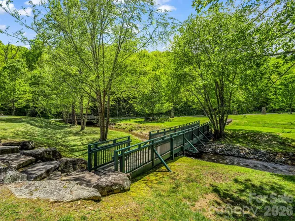 a view of a park with large trees