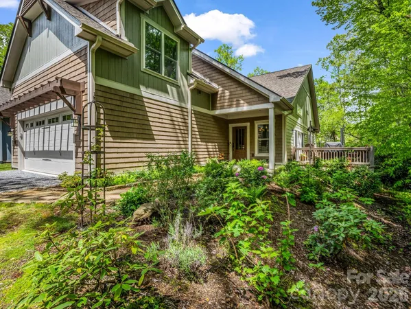 a view of a house with balcony and garden