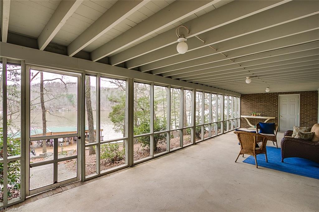551 Shamrock Road New London, NC 28127 - Photo 22 of 29 ANOTHER screened-in porch off of the finished basement. Plenty of space for everyone!