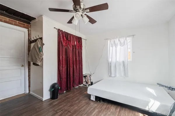 a room with a bed and a mirror