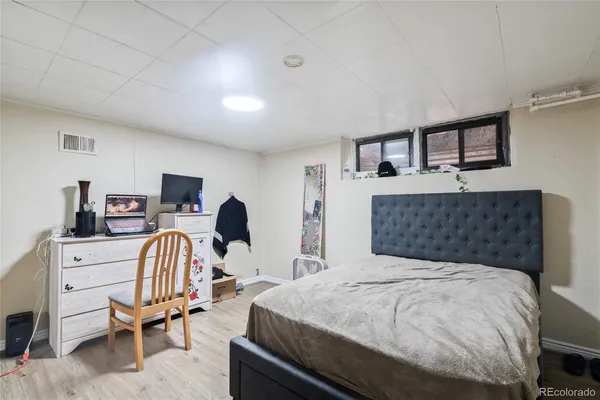 a bedroom with a bed and a chair