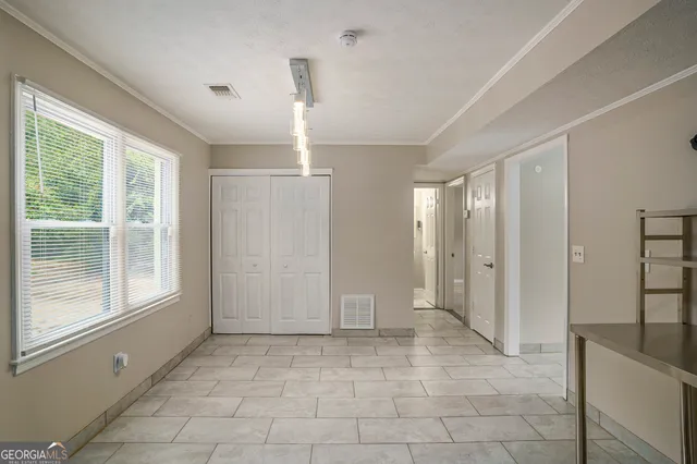 a view of an empty room and window