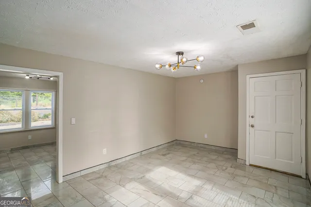 a kitchen with stainless steel appliances a refrigerator sink and cabinets
