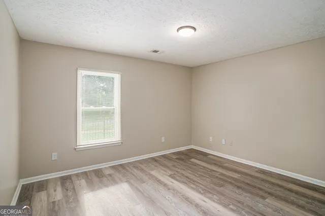 a bathroom with a sink a bathtub and a mirror