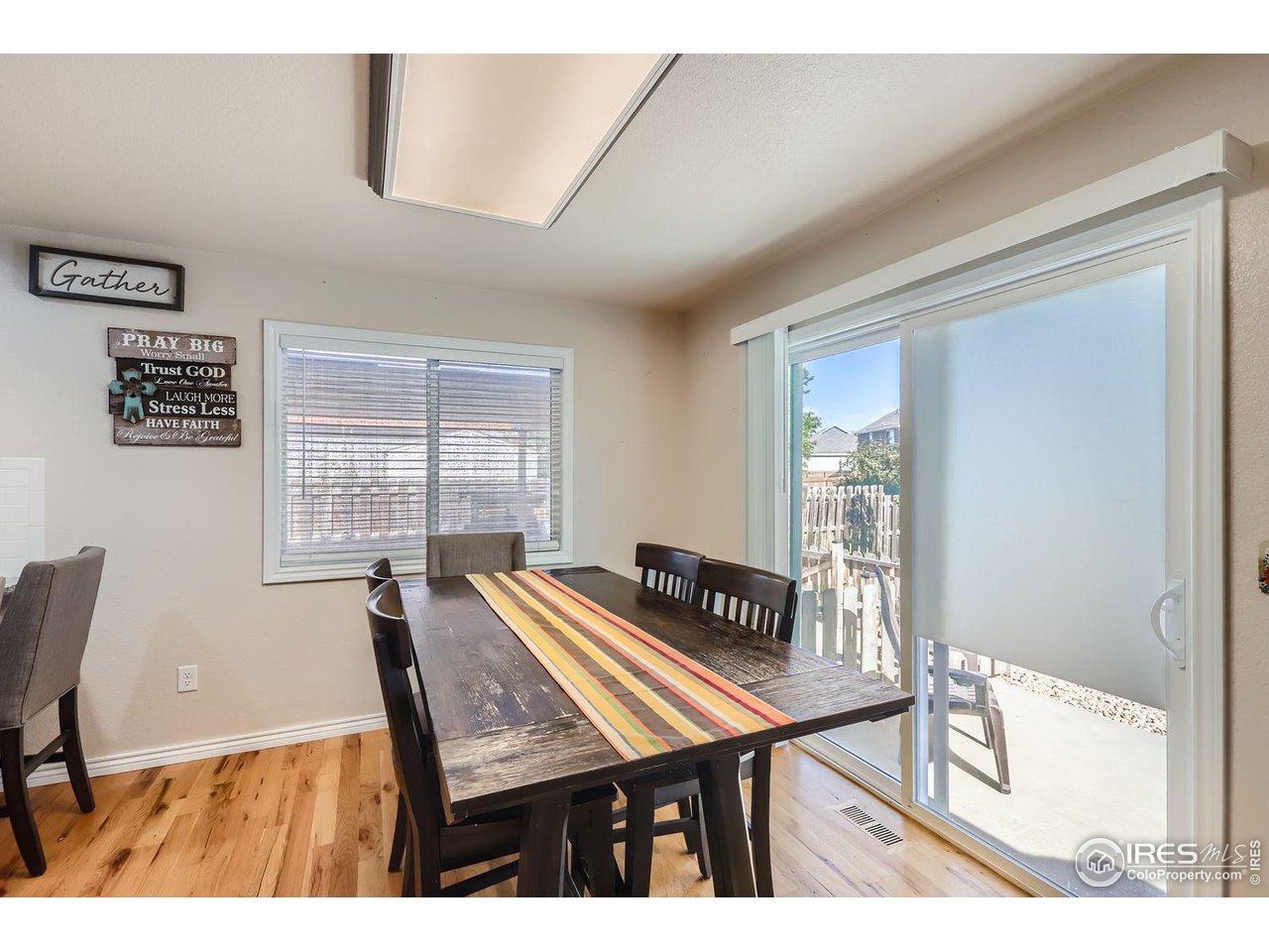 135 Falcon Circle Mead, CO 80542 - Photo 14 of 27 a view of a dining room with furniture window and outside view