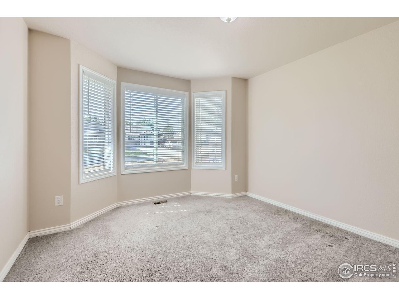 135 Falcon Circle Mead, CO 80542 - Photo 18 of 27 an empty room with windows