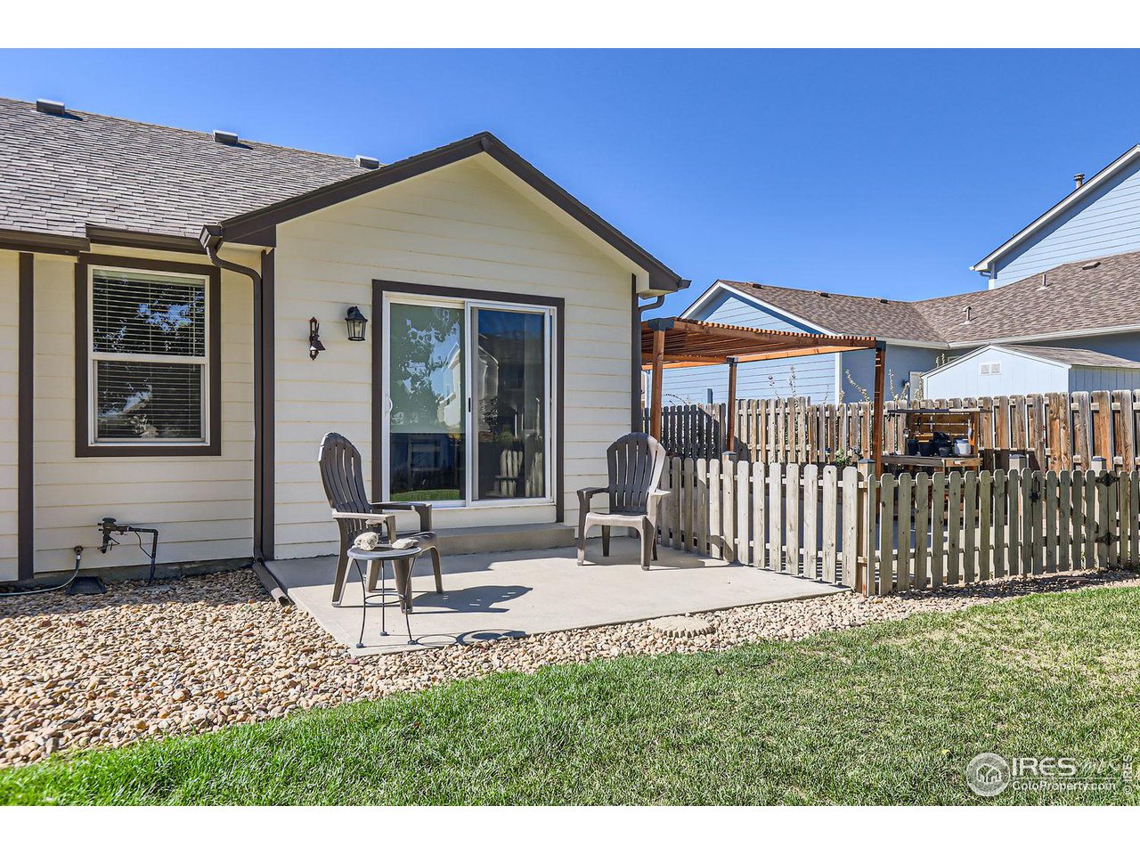 135 Falcon Circle Mead, CO 80542 - Photo 23 of 27 a backyard of a house with table and chairs