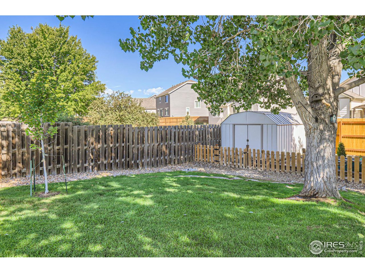135 Falcon Circle Mead, CO 80542 - Photo 25 of 27 a garden with wooden fence