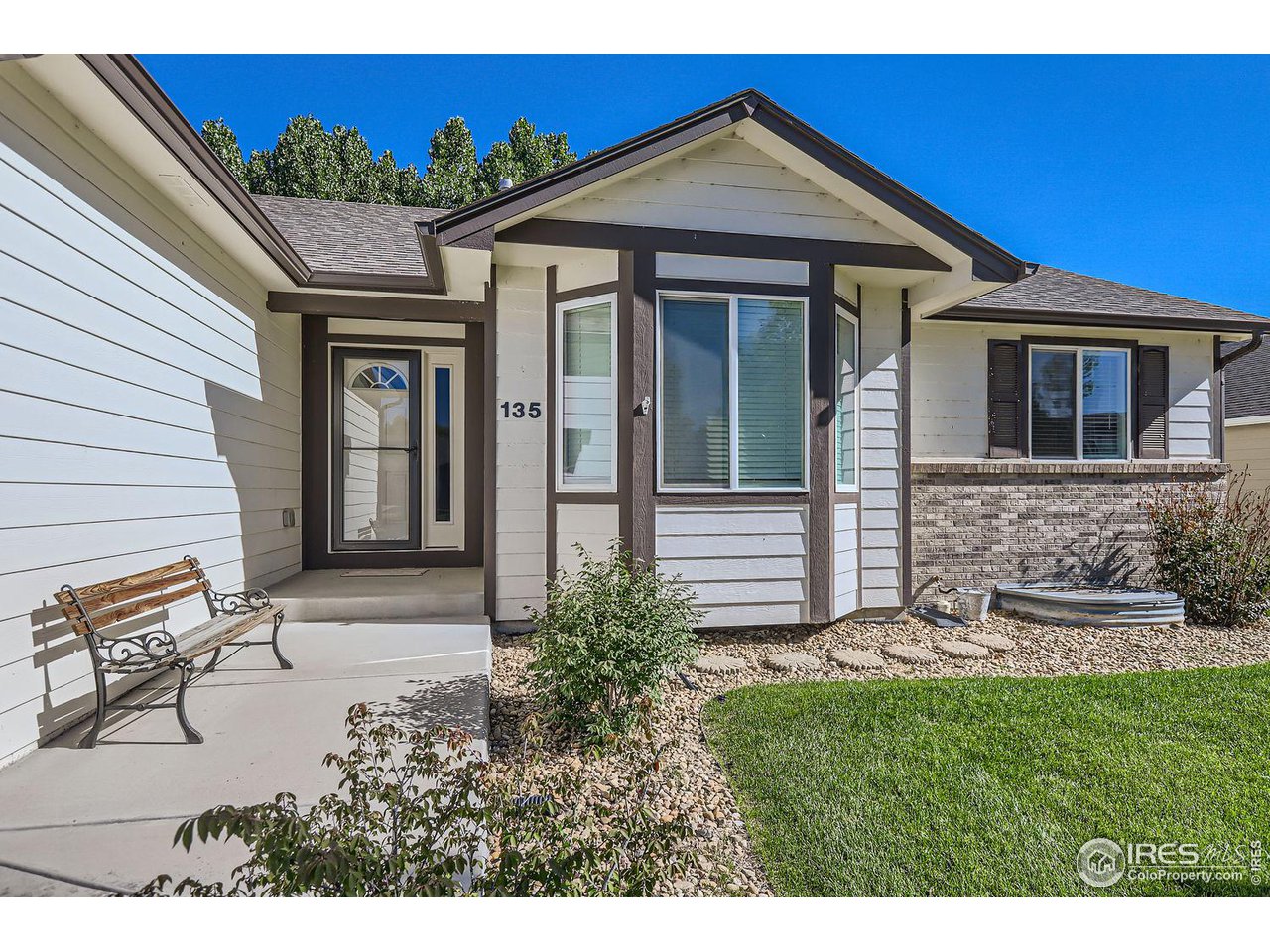135 Falcon Circle Mead, CO 80542 - Photo 3 of 27 a front view of a house with a yard
